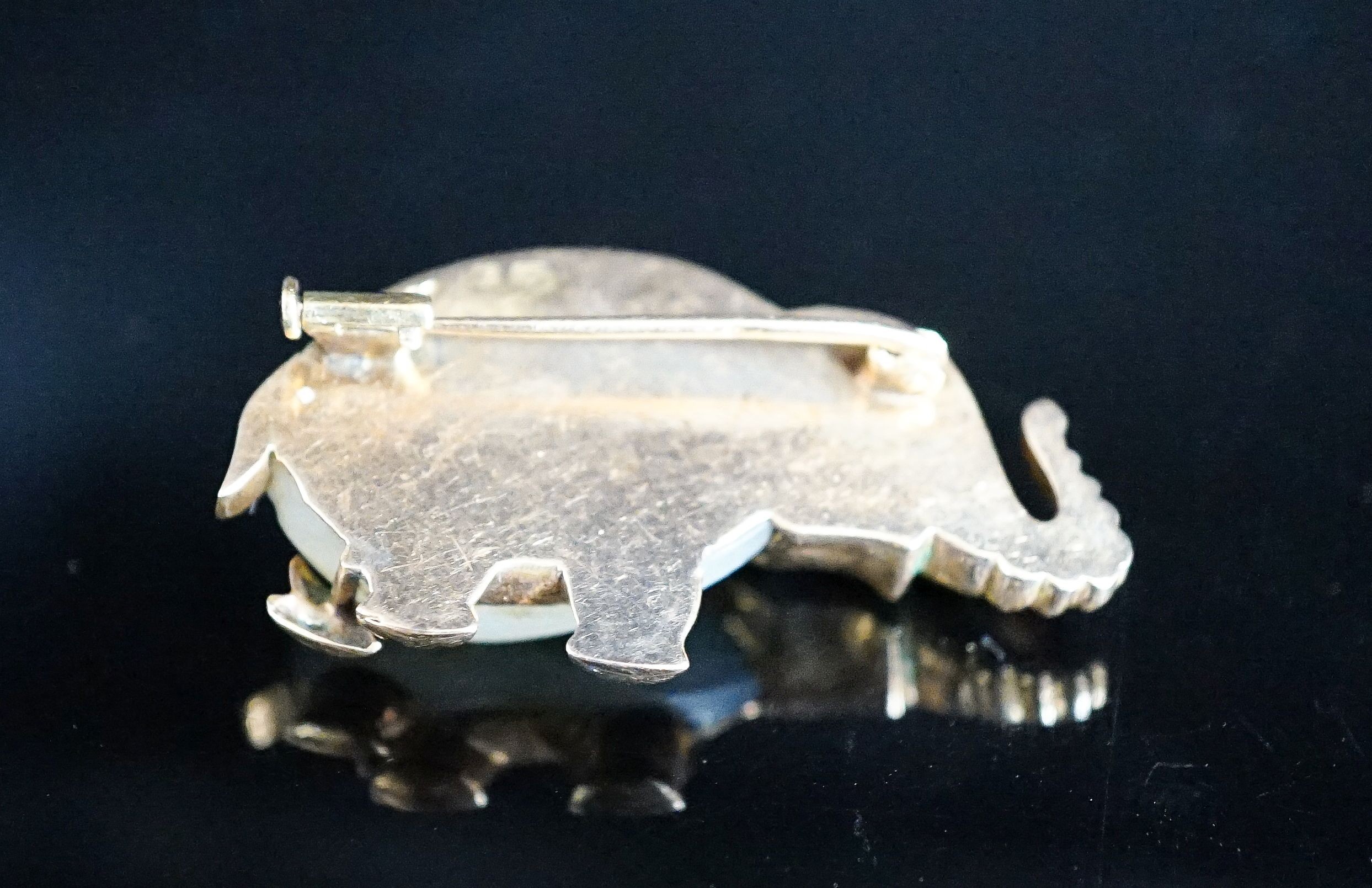 A 20th century Viennese 585 yellow metal, mother of pearl and cabochon set brooch, modelled as an elephant, 36mm, gross weight 10 grams.